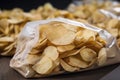 close-up of bagged potatoes chips, with view of product and price visible