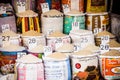 Close-up of bags of cereals and spices in a local country fair with italian names and prices Royalty Free Stock Photo