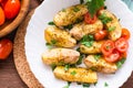 Close up of baked potatoes with ripe tomatoes Royalty Free Stock Photo