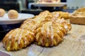 Close-up of bakery pastry shop display with fresh sweet buns with cream Royalty Free Stock Photo