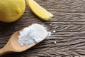 Close up of baking soda (sodium bicarbonate) in a wooden spoon on the table. Royalty Free Stock Photo