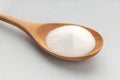 Baking Soda In Wooden Spoon isolated on gray background Royalty Free Stock Photo