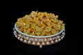 A close-up of baklava sweets with pistachios. Decorate with dry rose flower. Arabic sweets for Ramadan