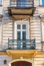 close-up balcony of a building with an openwork metal