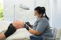 Close up of balding man getting hair mesotherapy or scalp prp. Platelet-rich plasma procedure. Cosmetologist doctor