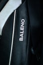 Close up of the Baleno emblem on a leather car seat