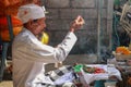 Close up of a Balinese pedanda during prayer. side view of a hindu priest performing a ceremony. A hindu priest performing