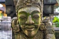 Close up of a balinese traditional statue of a mythological man in Tirta Empul Temple