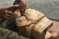 close up of a Balinese woodcarver making wooden Barong mask Royalty Free Stock Photo