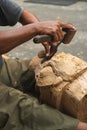 close up of a Balinese woodcarver making wooden Barong mask Royalty Free Stock Photo