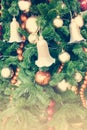 Close up ball and bell on Christmas Tree with retro filter effect (vintage style) Royalty Free Stock Photo