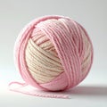 Close Up of Ball of Pink and Beige Yarn on White Background Royalty Free Stock Photo