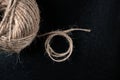 Close-up of a ball of twine rope on a dark background. Selective focus Royalty Free Stock Photo