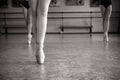 Close-up of ballerina feet on pointe shoes in the dance hall. Vintage photography. Close-up of a ballerina in the dance hall. Royalty Free Stock Photo