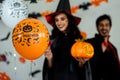 Close up balloon pumpkin. Young couple party and celebrate with Halloween pumpkin and cocktails background.