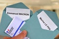 Ballot papers for Emmanuel Macron and Marine Le Pen with a close-up electoral card