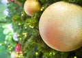 Close up of balls on christmas tree. Bokeh garlands in the background Royalty Free Stock Photo