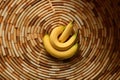 a close-up of a banana cut into spiral shapes on a bamboo mat