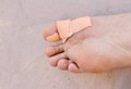 Close up of bandage on boy big toe. intended selective focused Royalty Free Stock Photo