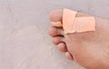 Close up of bandage on boy big toe. intended selective focused Royalty Free Stock Photo