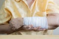 Close-up bandaged arm of a old woman because of a skin lesion Royalty Free Stock Photo
