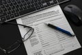 Close up of a bankruptcy form on desk with keyboard, mouse and pen Royalty Free Stock Photo