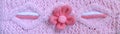 Close up banner with knitted pink ornament