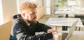 Close-up banner male guy portrait resting in coffee shop chatting in social networks skilled freelancer enjoying remote Royalty Free Stock Photo