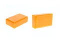 Close up bar of orange carrot soap isolated on white Royalty Free Stock Photo