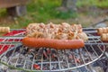 Close up barbecue grill with meat and sausages cooking during summer