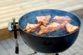 Close up of barbecue meat roasting on grill Royalty Free Stock Photo