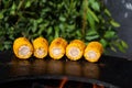 Close-up of barbecued sweet corn over dark background