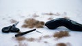 close up of Barber tools and a lot of cut hair from the body, on white background. tools for depilation, hair Royalty Free Stock Photo