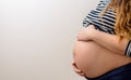 Close up of the bare belly of a pregnant woman Royalty Free Stock Photo