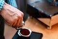 Close Up Of Barista Hands Holding Portafilter With Ground Coffee. Coffee Preparation At Home. Good Coffee Without Leaving Home