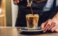 Close-up a barista making fres ice coffee on barcounter Royalty Free Stock Photo
