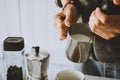 Close- up , Barista is milk steaming, frother latte art in coffee mug at home in the morning Royalty Free Stock Photo