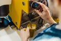 Close up of barista steaming milk in the pitcher with coffee machine. Royalty Free Stock Photo