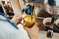 Close up of barista steaming milk in the pitcher with coffee machine. Royalty Free Stock Photo