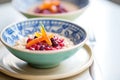 close-up of barley porridge with a swirl of berry compote