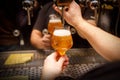 Close-up of barman hand at beer tap pouring draught craft beer Royalty Free Stock Photo