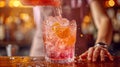 Close-up of barman making cocktail with fresh raspberries