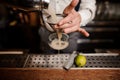 Close up barmans hands with cocktail Royalty Free Stock Photo