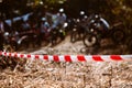 Close-up of barricade plastic rope with mountain bikes racing