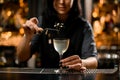 Close-up of bartender adding small branch in cocktail Royalty Free Stock Photo