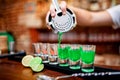 Close-up of bartender hand pouring alcoholic drink