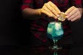 Close-up of a bartender making a blue cocktail Royalty Free Stock Photo