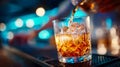 Close-up of a bartender pouring liquid into a glass with splashes and bokeh lights Royalty Free Stock Photo