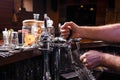 Close-up of bartenders hands pouring beer Royalty Free Stock Photo