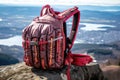 close-up of base jumpers parachute backpack on cliff edge